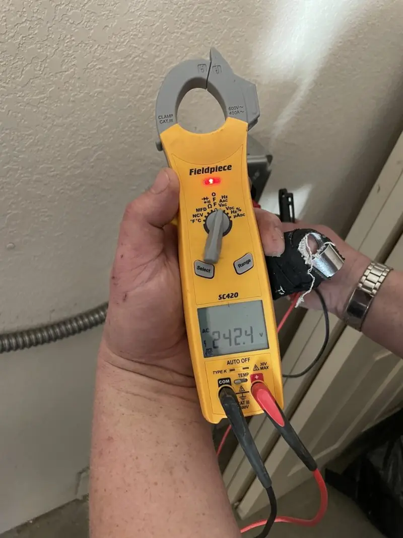 Voltage testing with clamp meter during Aluminum Wiring Replacement in Dubuque
